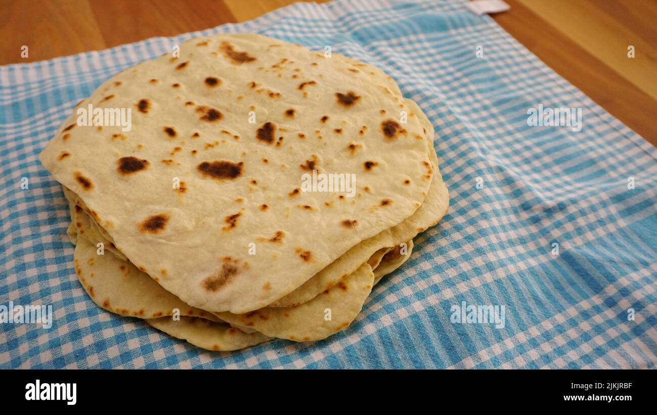 Hand made lavash bread and Turkish breakfast on wooden table Stock