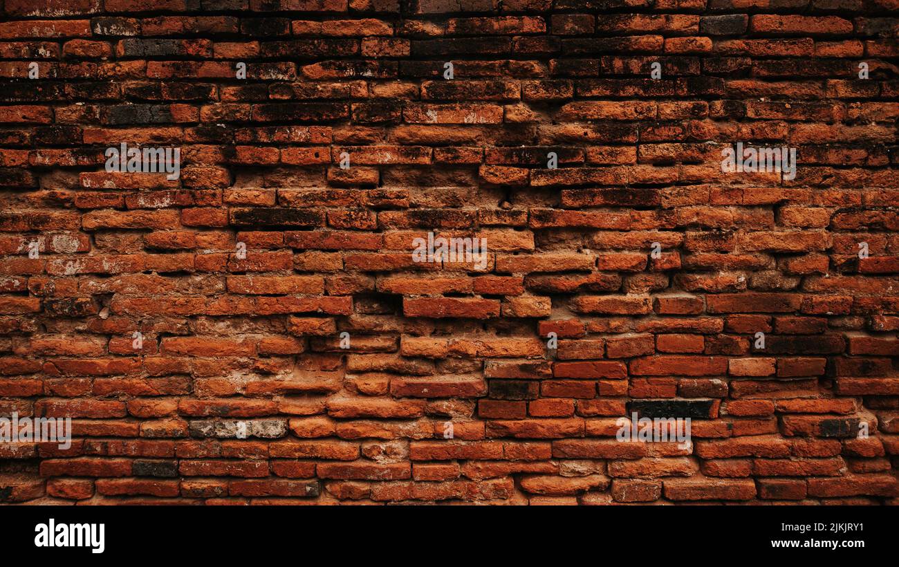 An old grungy red brick wall background Stock Photo
