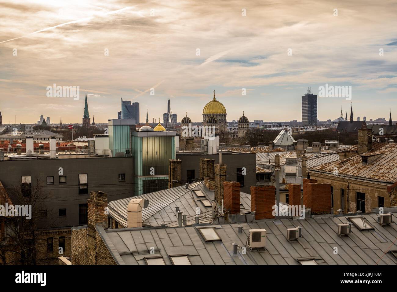 An aerial shot of the rooftops of the buildings of Kyiv on a sunny day against dusk sky, Ukraine Stock Photo