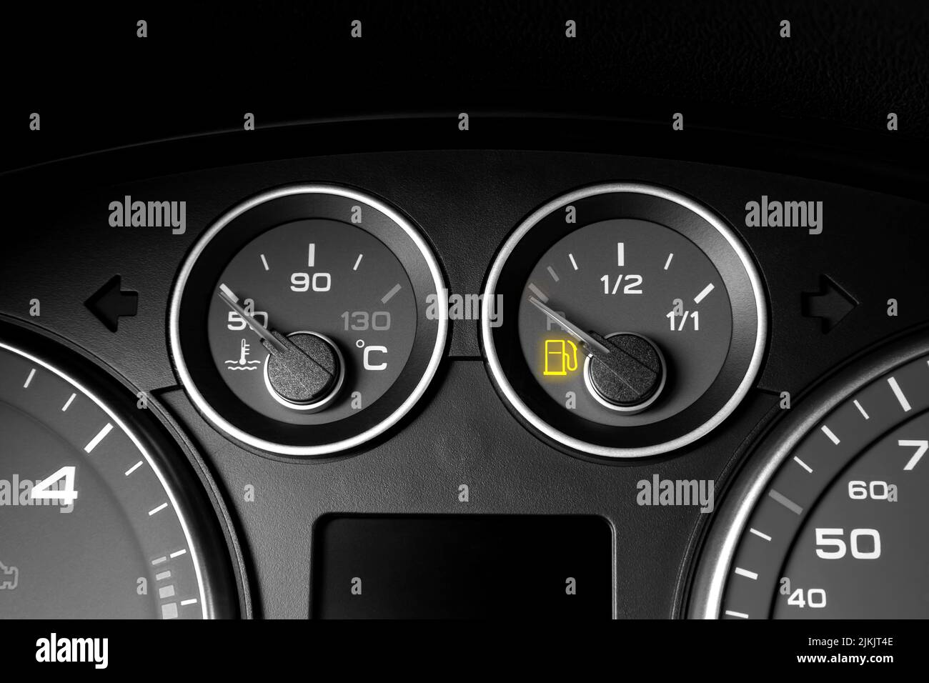 glowing fuel gauge on dashboard Stock Photo Alamy