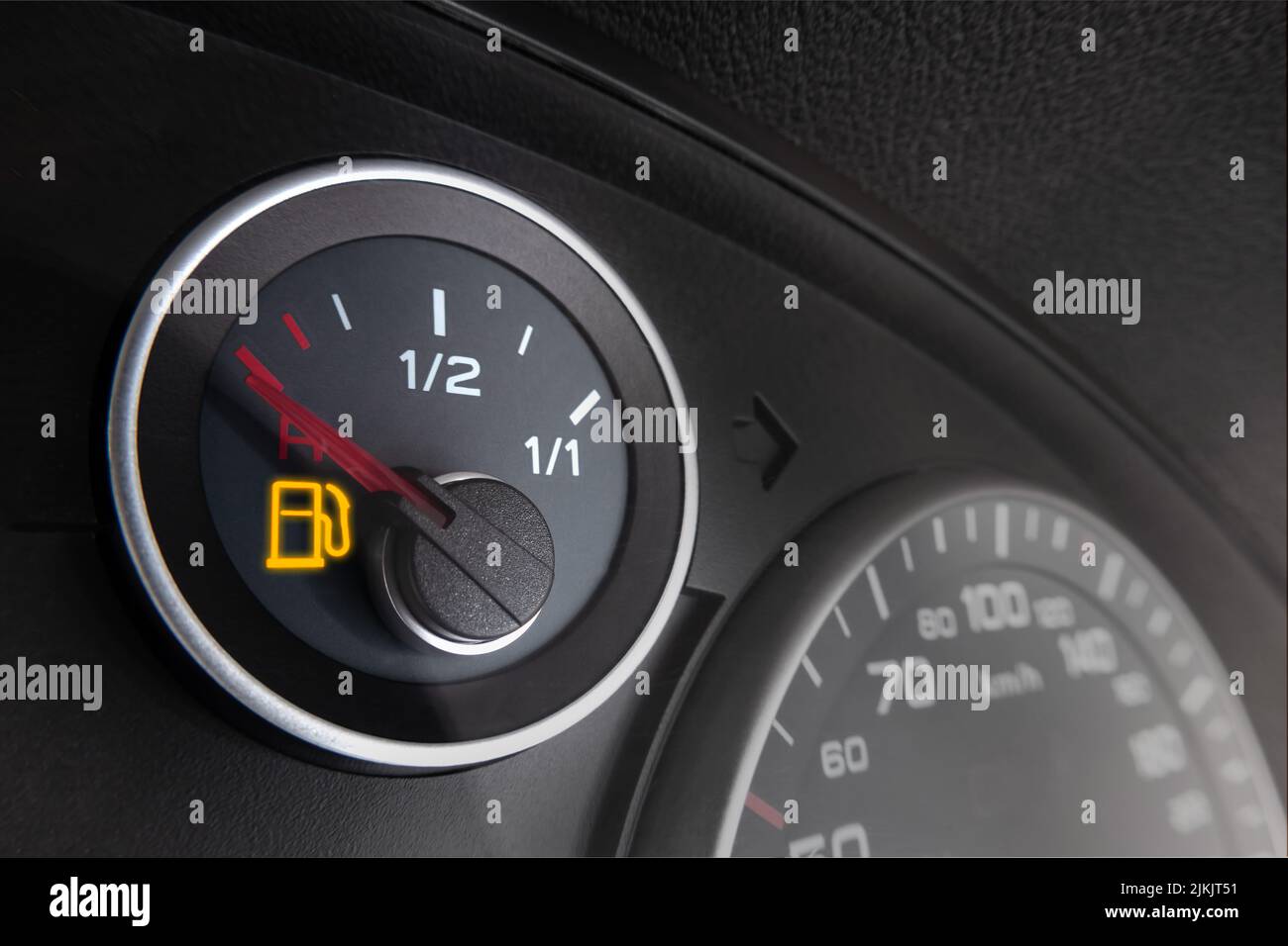 glowing fuel gauge on dashboard Stock Photo Alamy