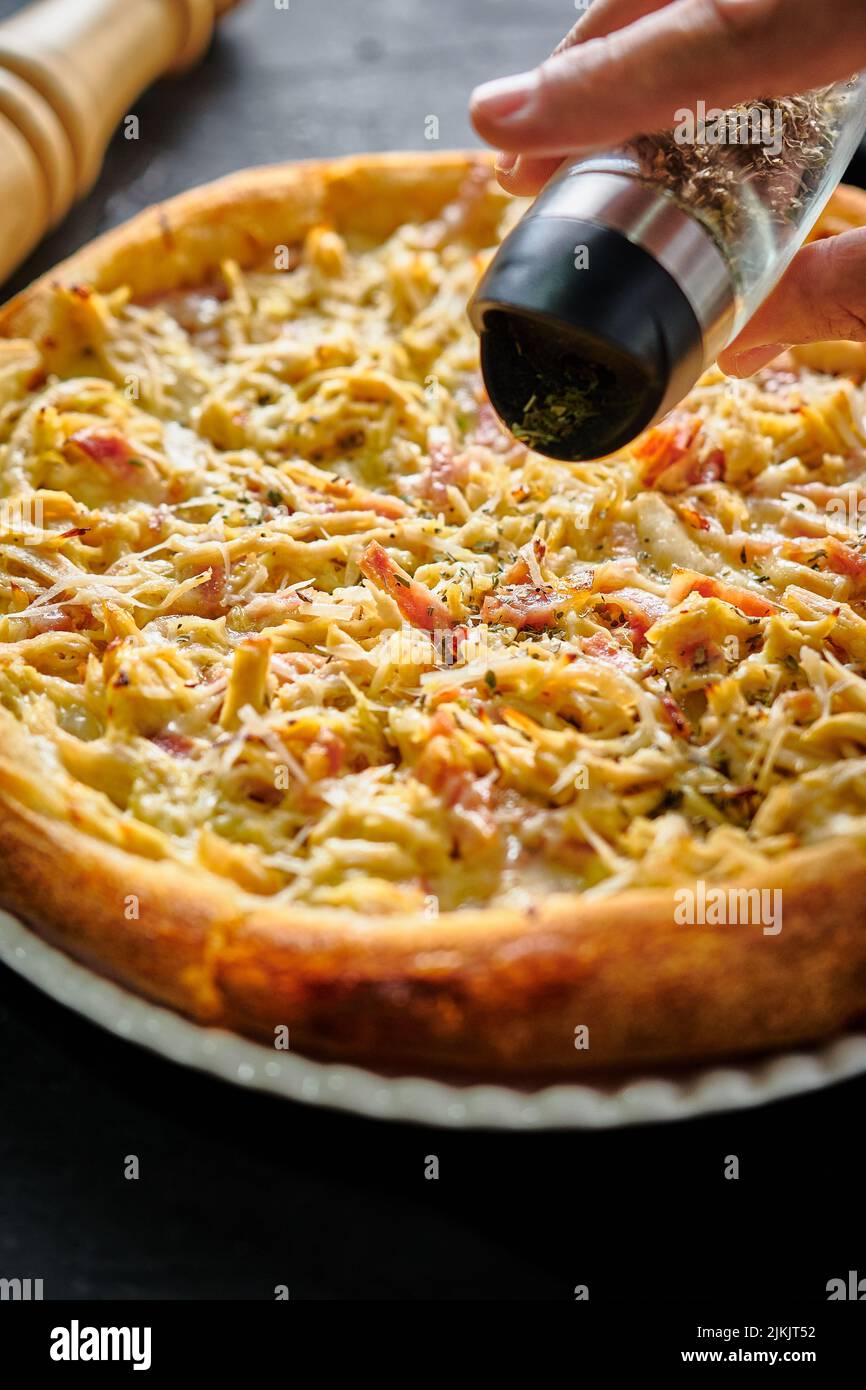 A selective focus shot of a delicious and appetizing pizza Stock Photo