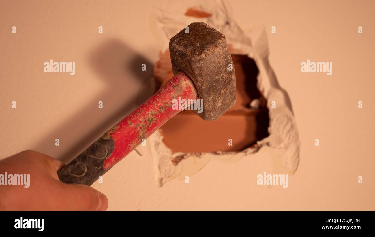 Punch hole. Tool for slotting. Punch on the floor. Broken concrete Stock Photo Alamy