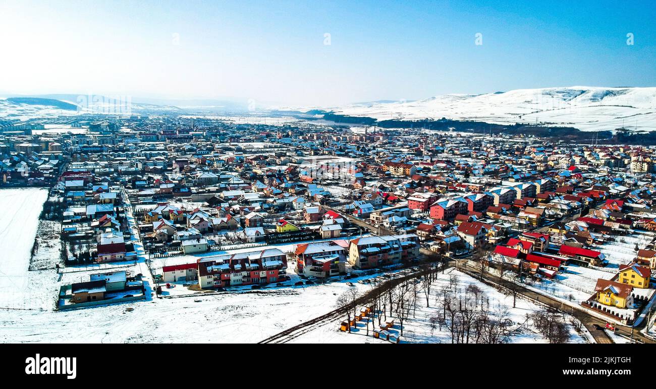 A panoramic view of Iqaluit city surrounded by snowy hills in Canada Stock Photo