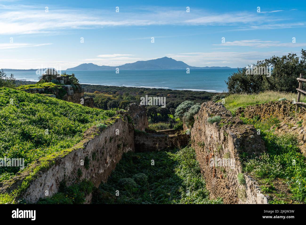 Scenic coastal landscape with Ischia island viewed from Cumae archaeological park, Pozzuoli, Campagnia region, Italy Stock Photo