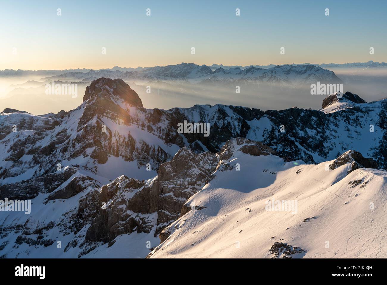 A scenic sunrise over the Alpstein with the Altmann in the foreground Stock Photo