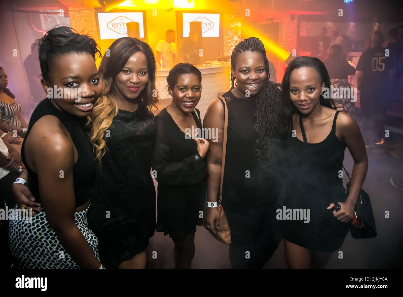 Johannesburg, South Africa December 11, 2015 Diverse people inside a night club bar Stock