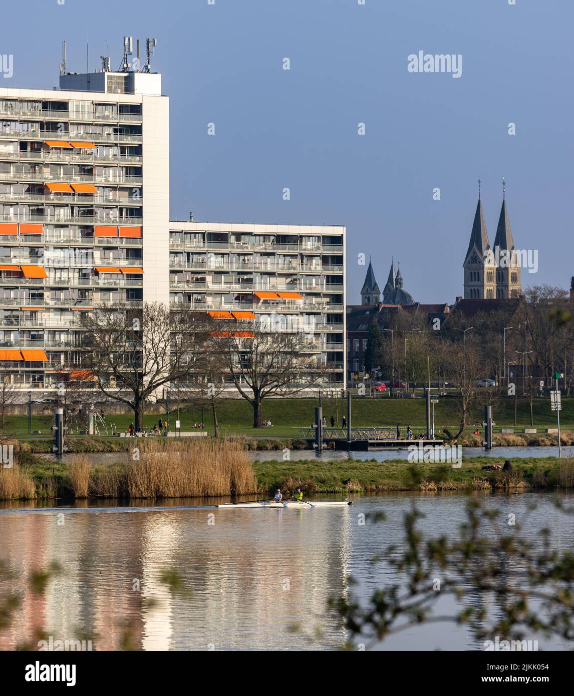 A shot of Arlo apartments with the Munsterkerk in the background in Roermond Stock Photo