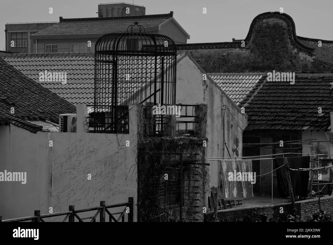 a-grayscale-shot-of-some-old-buildings-in-old-village-in-shanghai