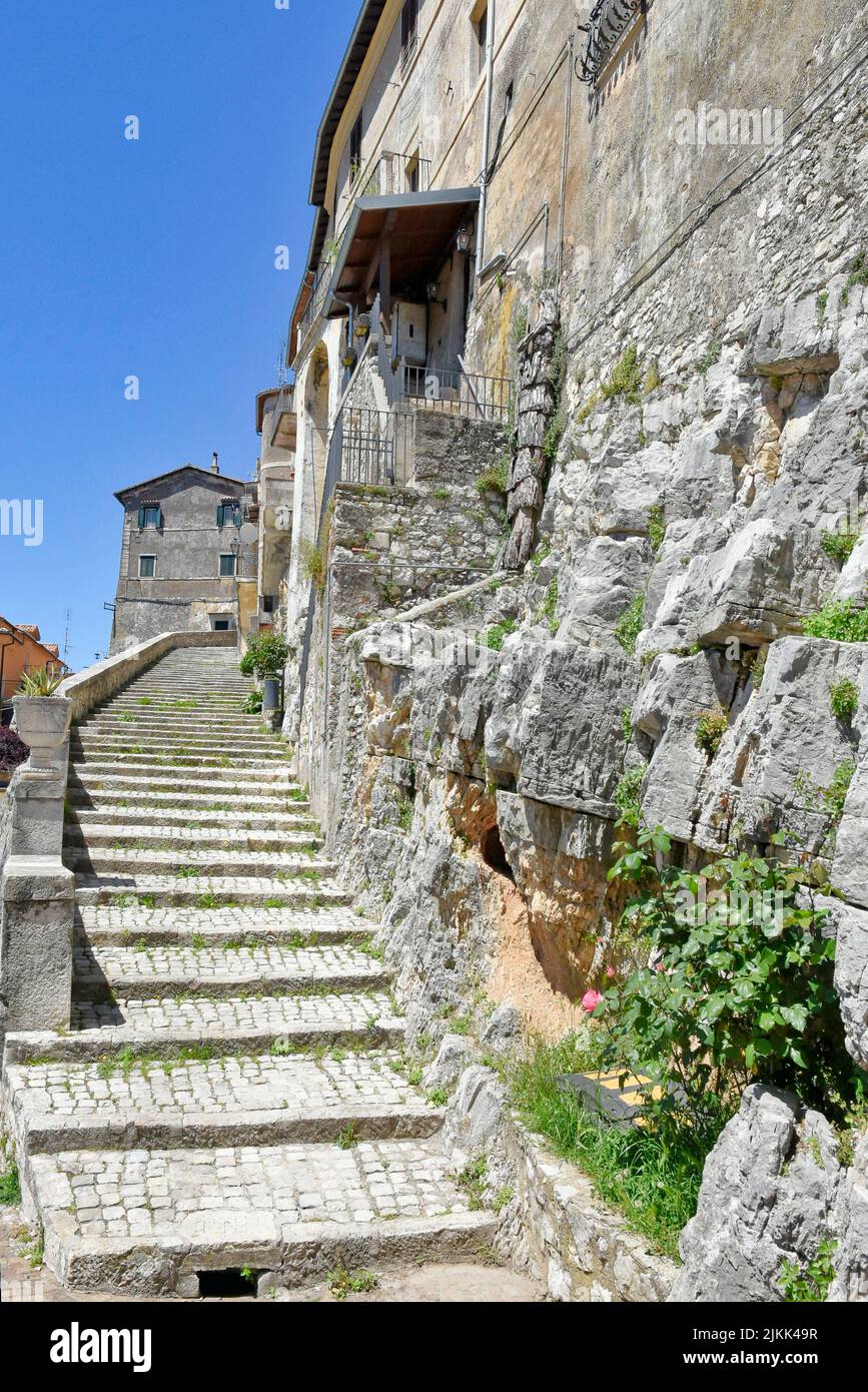 A street between old medieval stone buildings of Bassiano, historic town in Lazio region, Italy Stock Photo