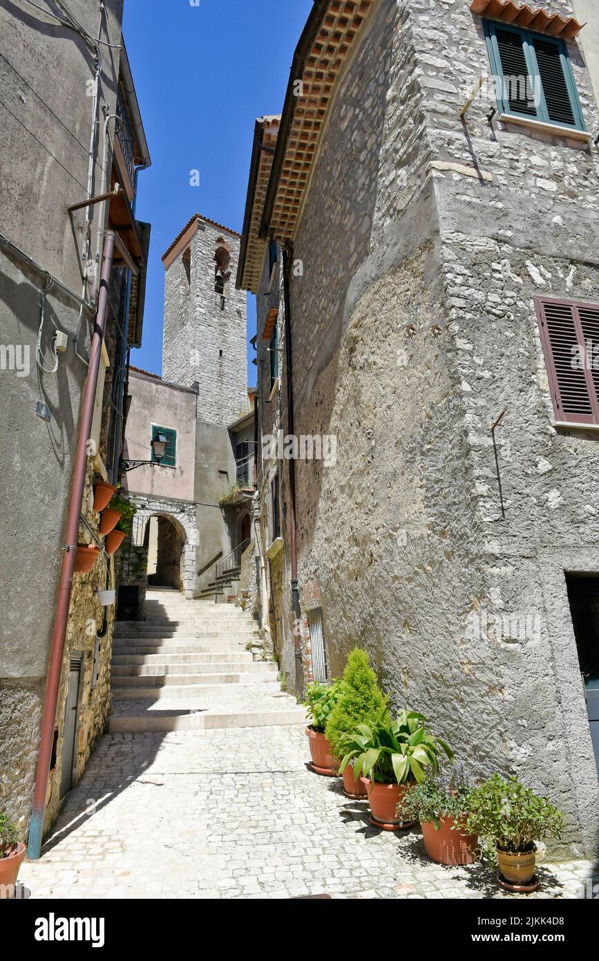 A street between old medieval stone buildings of Bassiano, historic town in Lazio region, Italy Stock Photo
