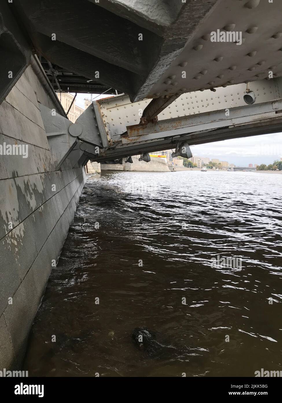 A river under the bridge in a city Stock Photo