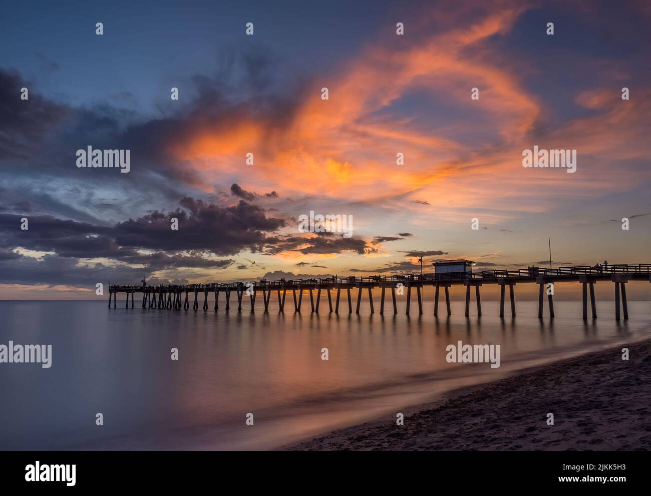 Sunset over the Gulf of Mexico and the Venice Pier in Venice Florida USA Stock Photo