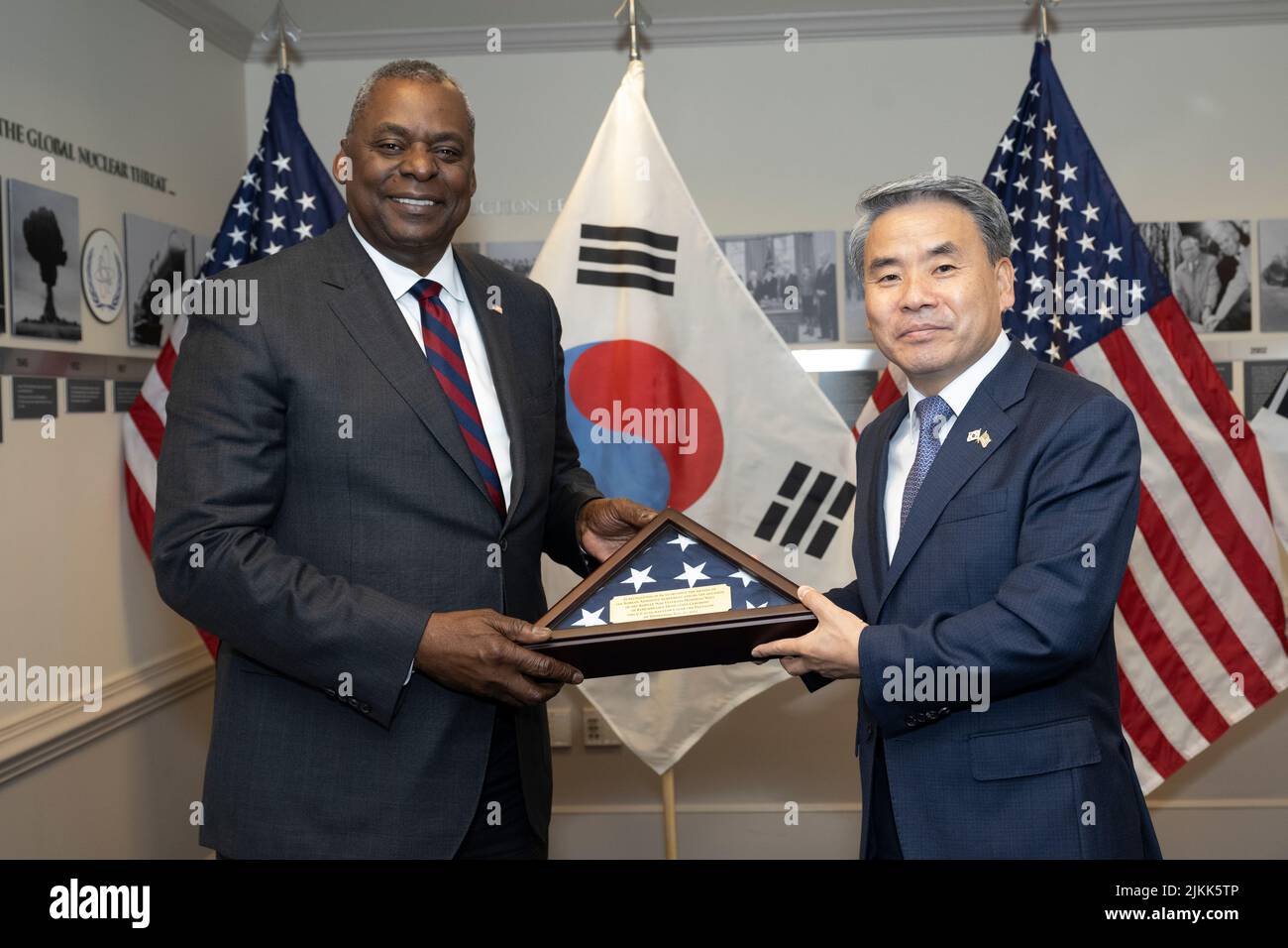 Arlington, United States of America. 29 July, 2022. U.S. Secretary of Defense Lloyd J. Austin III, presents a gift to South Korean Minister of National Defense Lee Jong-sup, right, before the state of bilateral talks at the Pentagon, July 29, 2022 in Arlington, Virginia.  Credit: Lisa Ferdinando/DOD/Alamy Live News Stock Photo