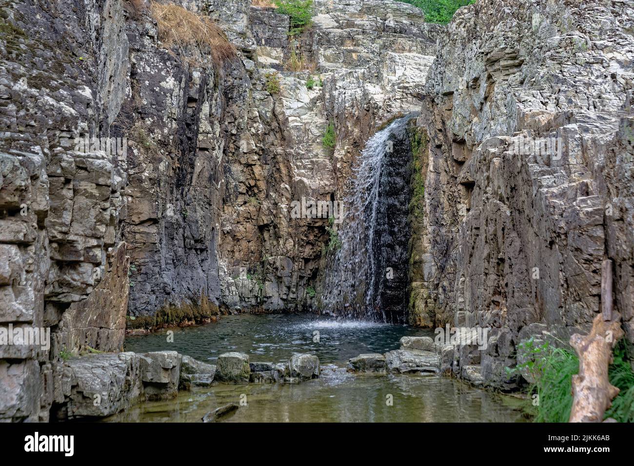 Small waterfall and pond which is one of the cascades named Cehennem Waterfalls near to Kirklareli Province in Turkey. Stock Photo