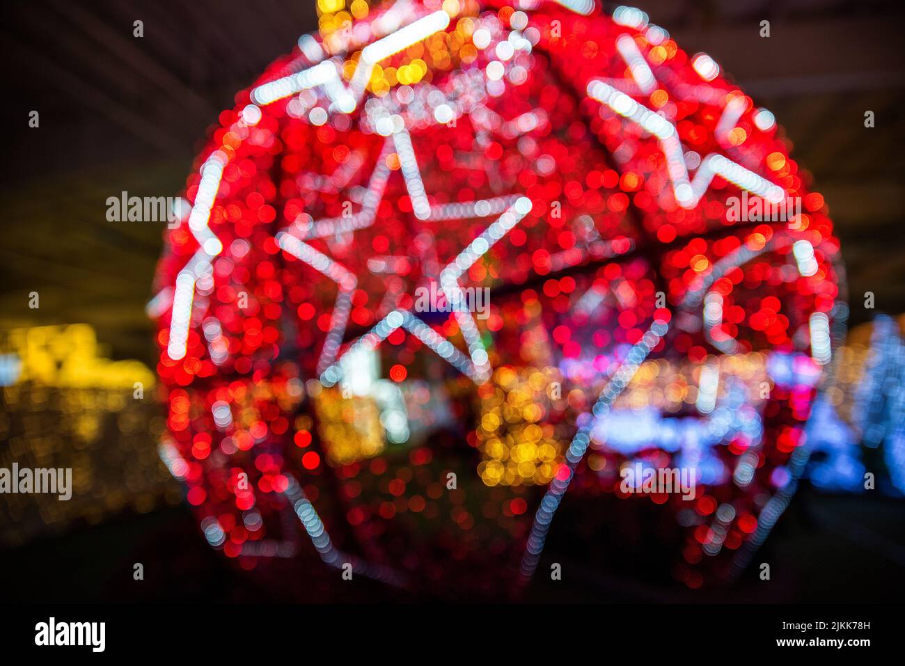 A blurry view of the round red figure with the white stars on it Stock Photo