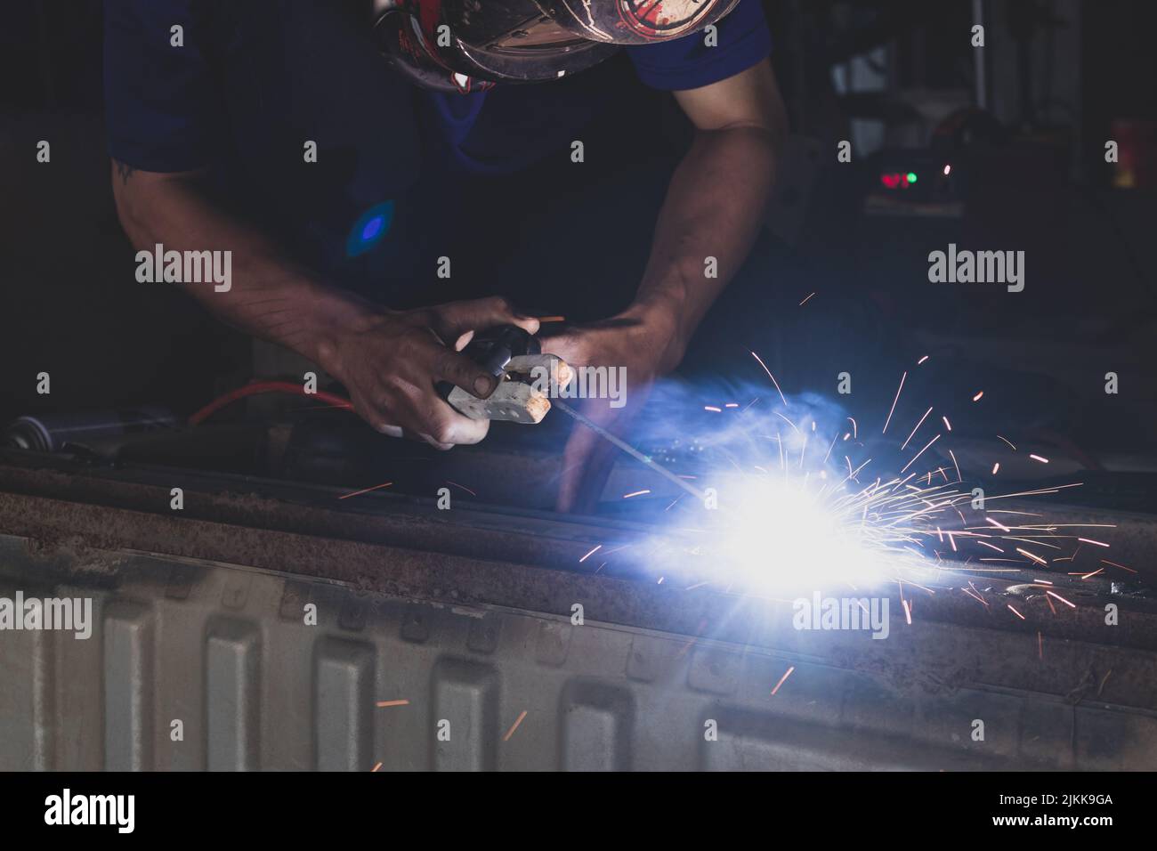 A welder welding automotive part in a car factory Stock Photo Alamy