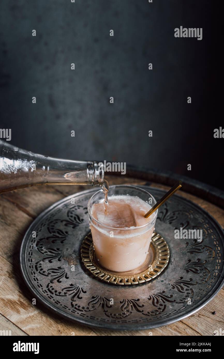 creamy drink cocktail with tamarind soda, nutmeg, cinnamon, cacao nibs