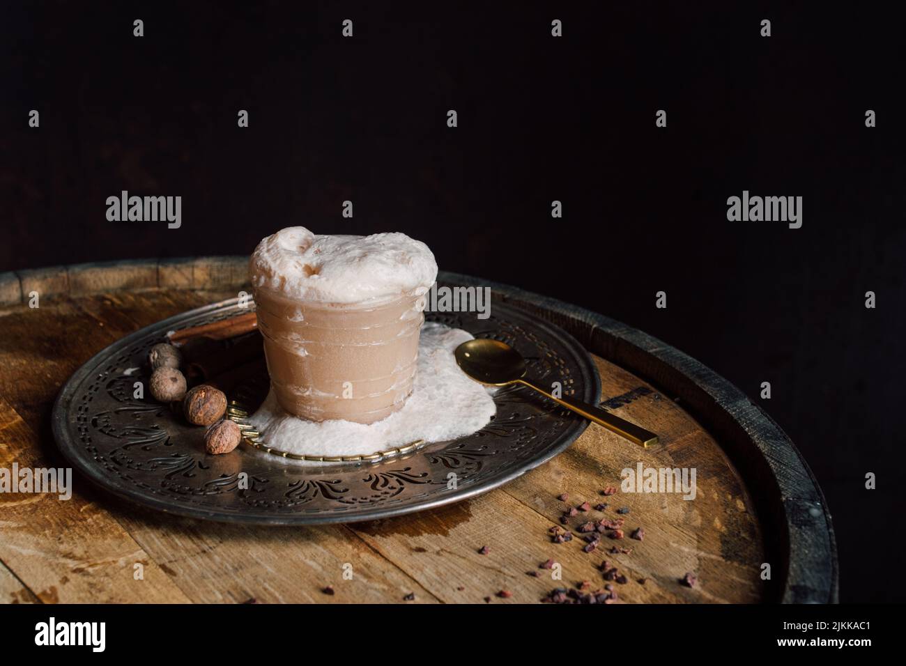 messy, overflowing root beer float style drink cocktail with nutmeg