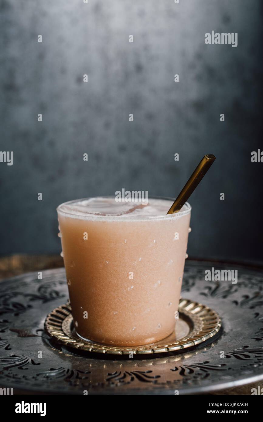 creamy drink cocktail with tamarind soda, nutmeg, cinnamon, cacao nibs