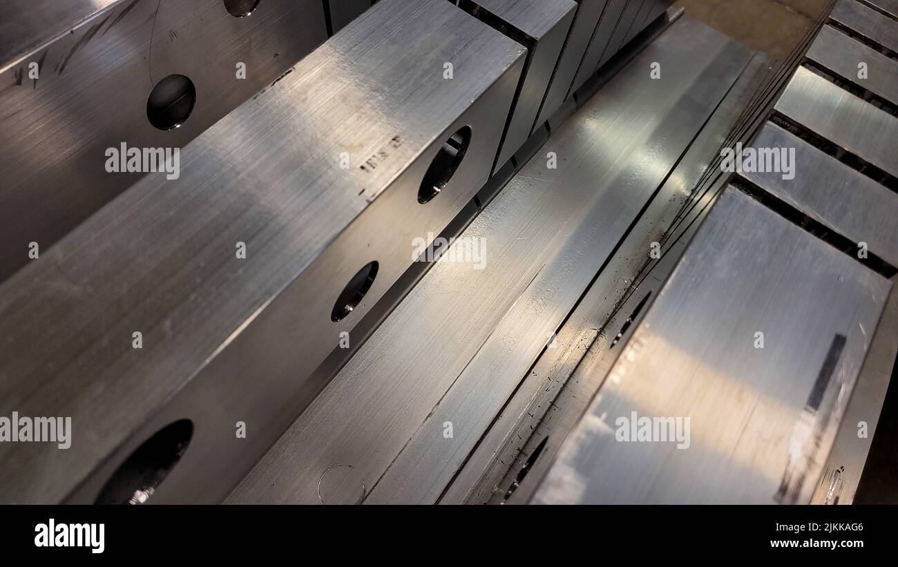 A closeup of aluminum extrusions in a manufacturing facility Stock