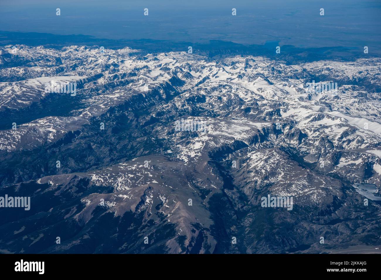 An aerial view of beautiful mountains covered in snow Stock Photo - Alamy