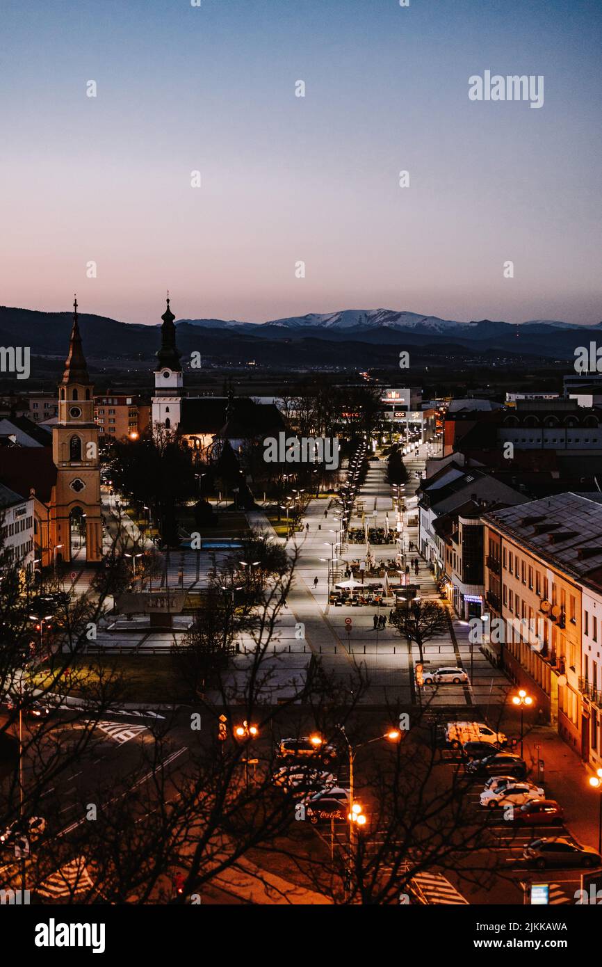 The main square in Zvolen city with mountains in the background during blue hour Stock Photo
