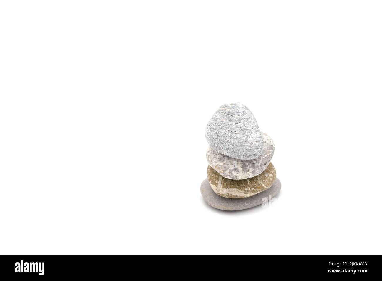 A wallpaper with four small rocks one over another isolated on the white background Stock Photo