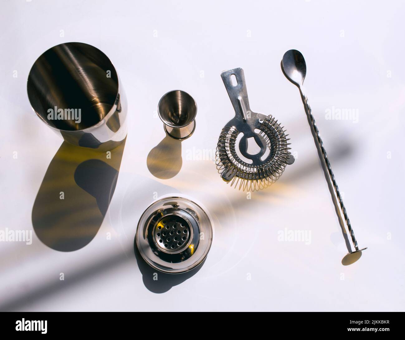 A top view of barware for making cocktails on a white background Stock Photo