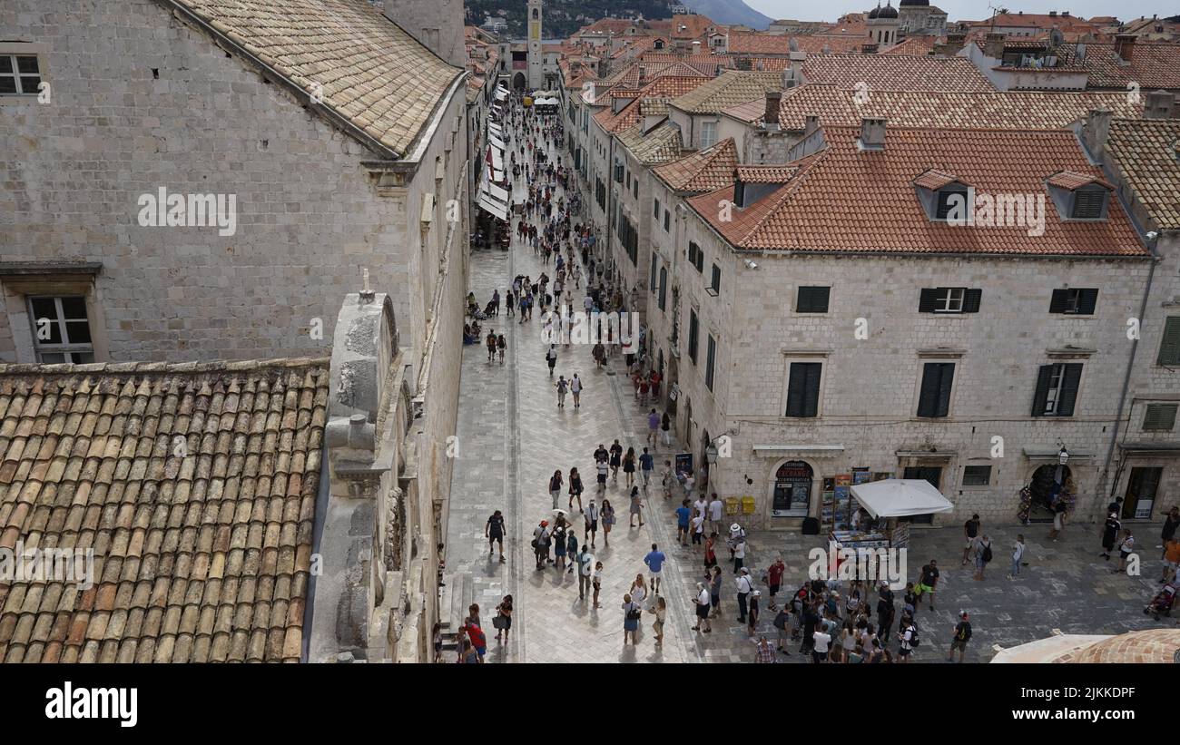 A high angle of people walking