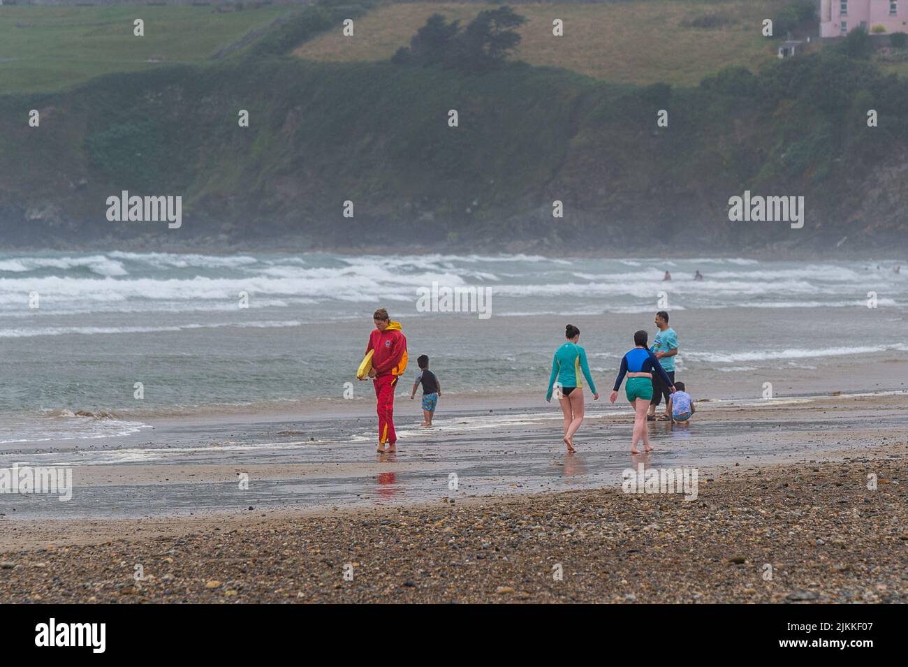 Tramore, Co. Waterford, Ireland. 2nd Aug, 2022. Gale force winds hit Tramore today with the red flags flying on the beach and only diehards in the water. Met Éireann has forecast sunshine and warm temperatures for the next two days. Credit: AG News/Alamy Live News Stock Photo