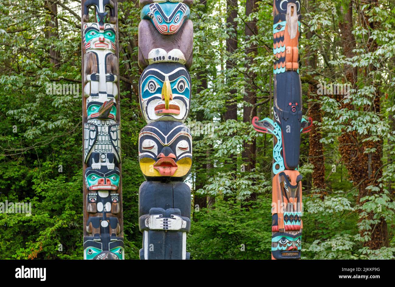 Native indigenous first nations totem poles in Stanley Park of Vancouver, British Columbia, Canada. Stock Photo