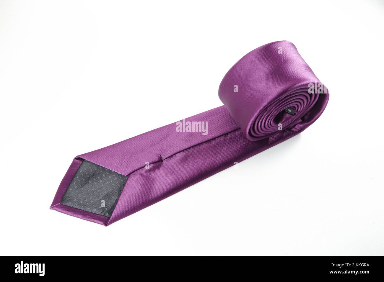 A purple polyester necktie isolated on a white background Stock Photo