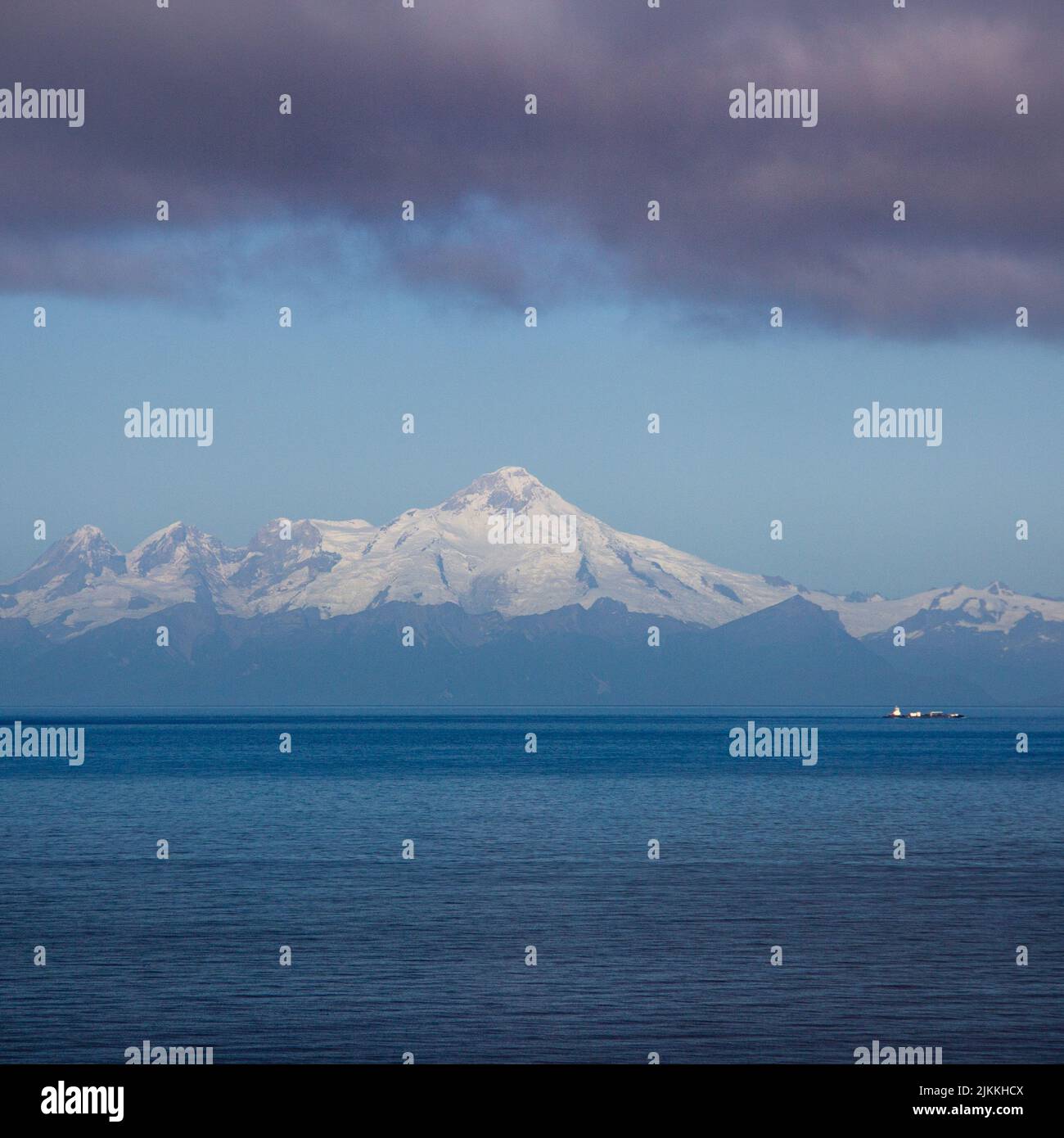 A vertical shot of the Mount Iliamna viewed from the Gulf of Alaska, USA Stock Photo