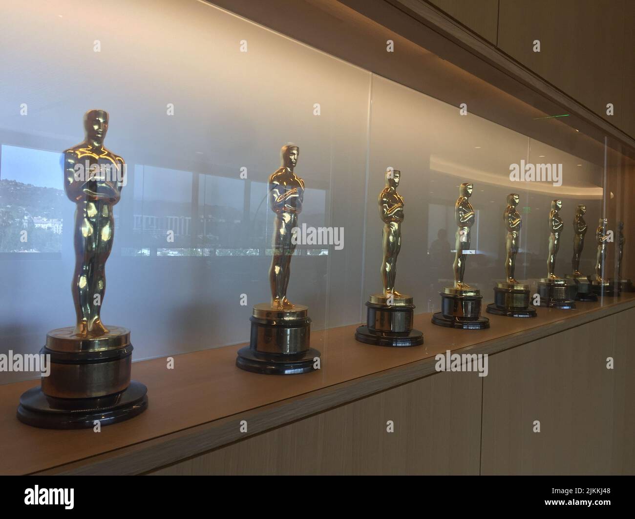 A row of Oscars on a shelf at the Academy of Motion Picture Arts and Sciences in Hollywood (Los Angeles), CA Stock Photo