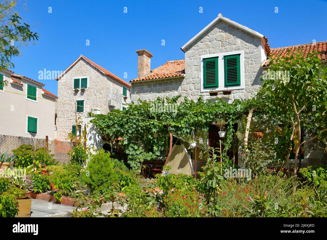 A beautiful stone house decorated with plants in Split, Croatia Stock Photo
