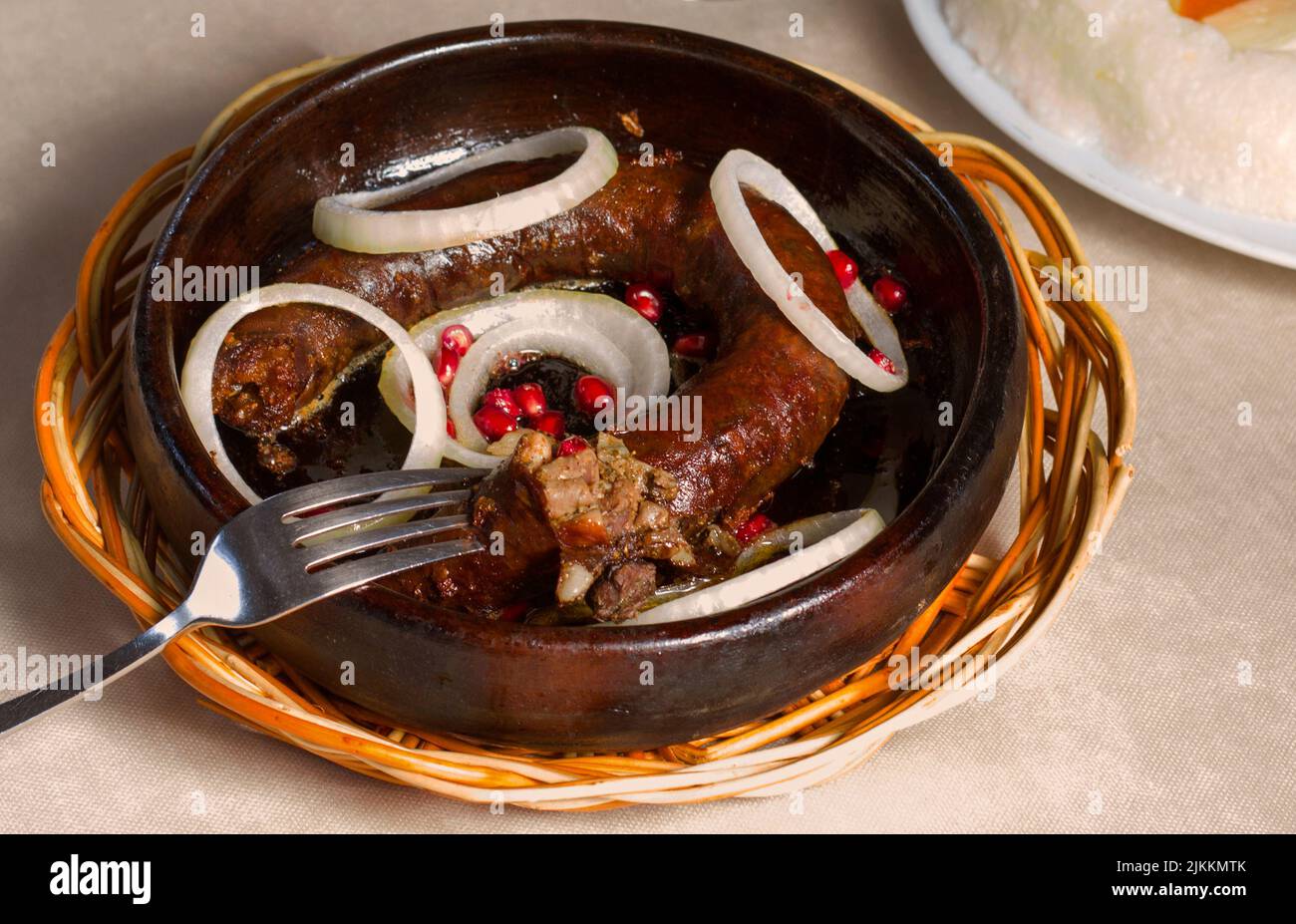 A closeup of Georgian traditional food Kupati, sausage made from ground pork. Stock Photo