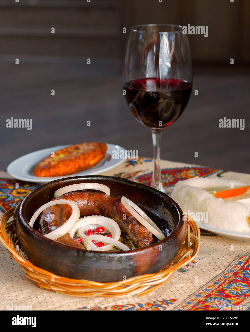 A vertical closeup of Georgian traditional food Kupati, sausage made from ground pork. Stock Photo