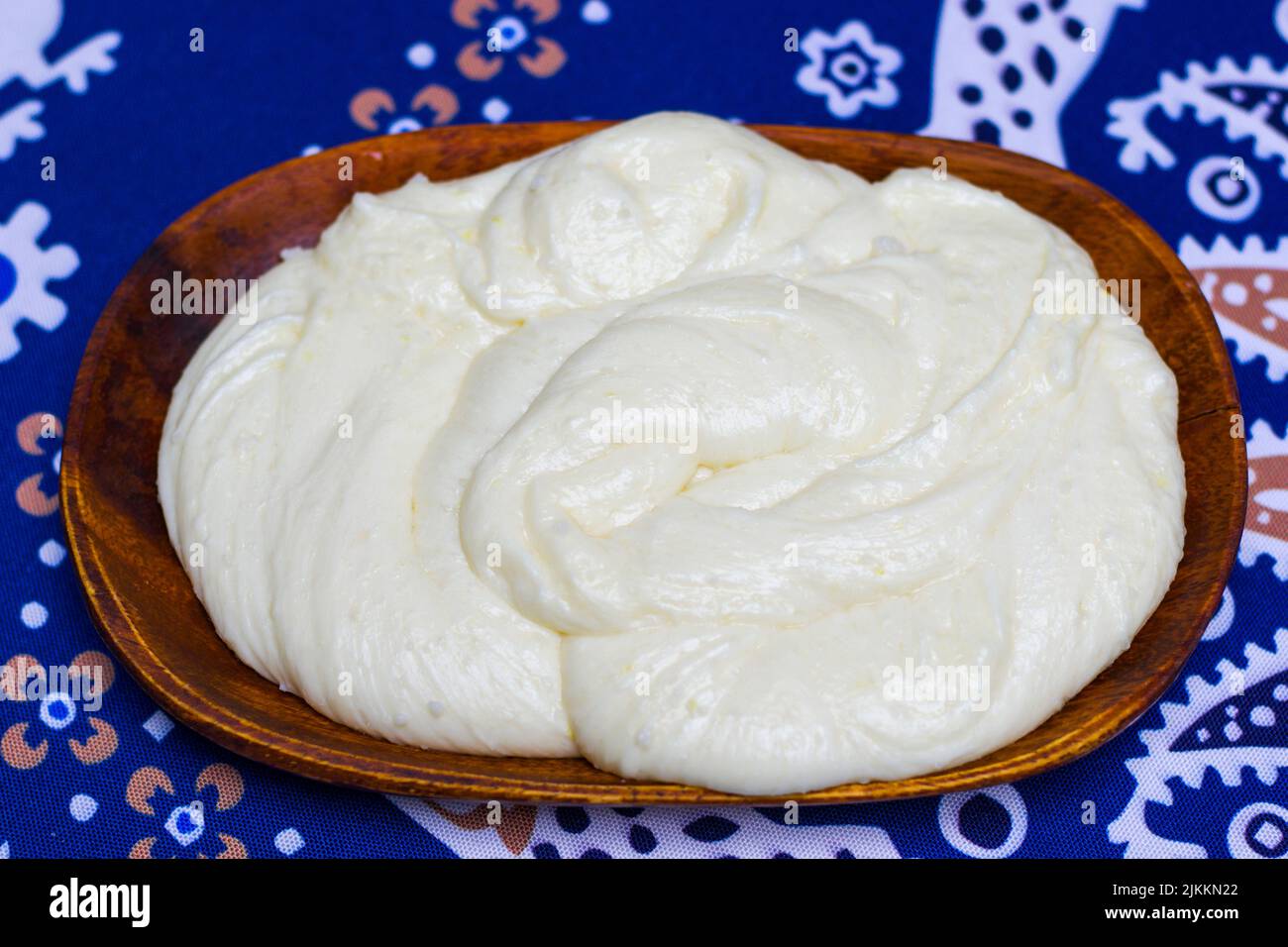 Georgian traditional food Elarji, meal with cheese and corn, baked and ready to eat, on the table in restaurant, Tbilisi, Georgia. Stock Photo