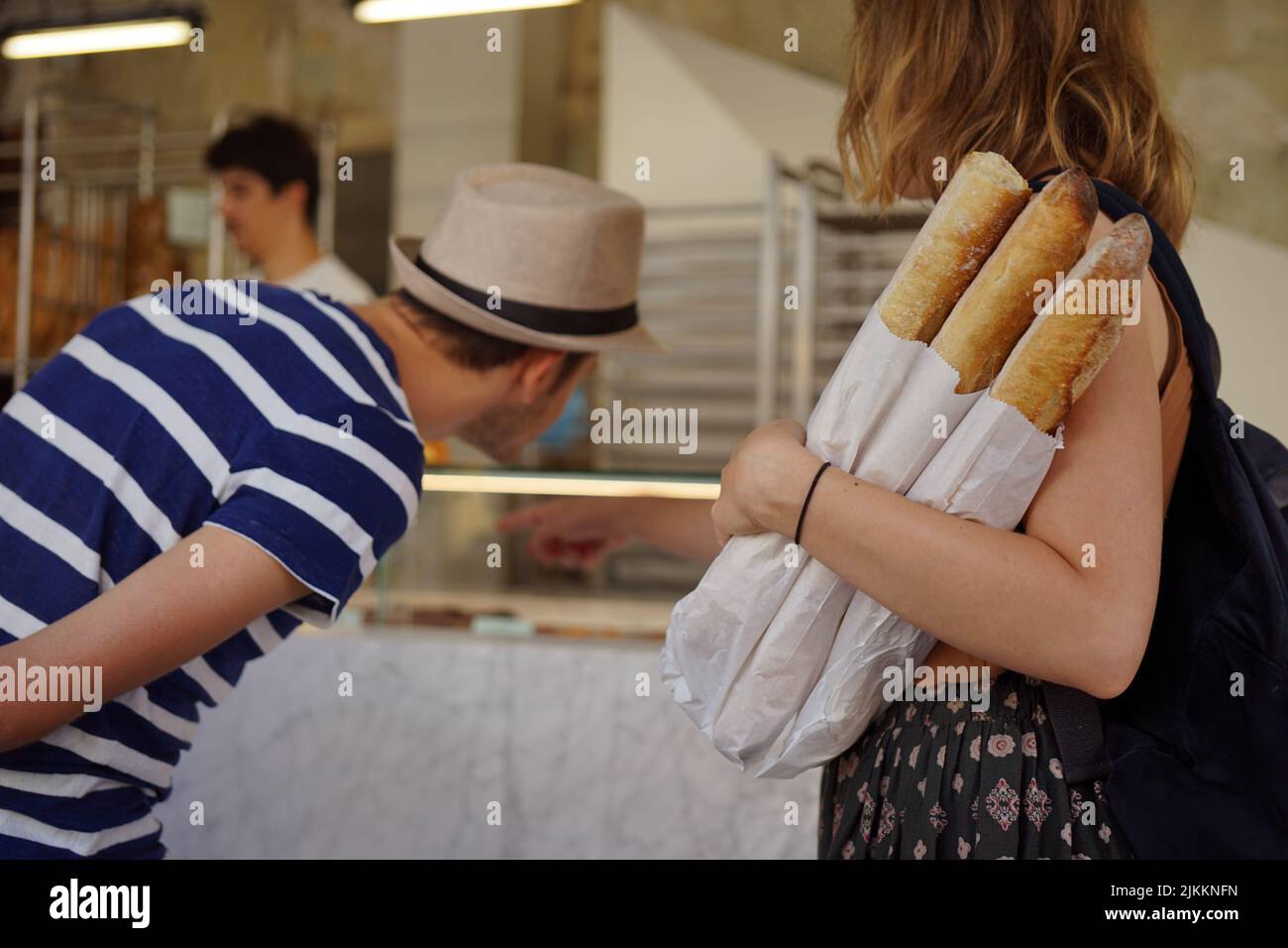 Girl holding baguettes Stock Photo Alamy