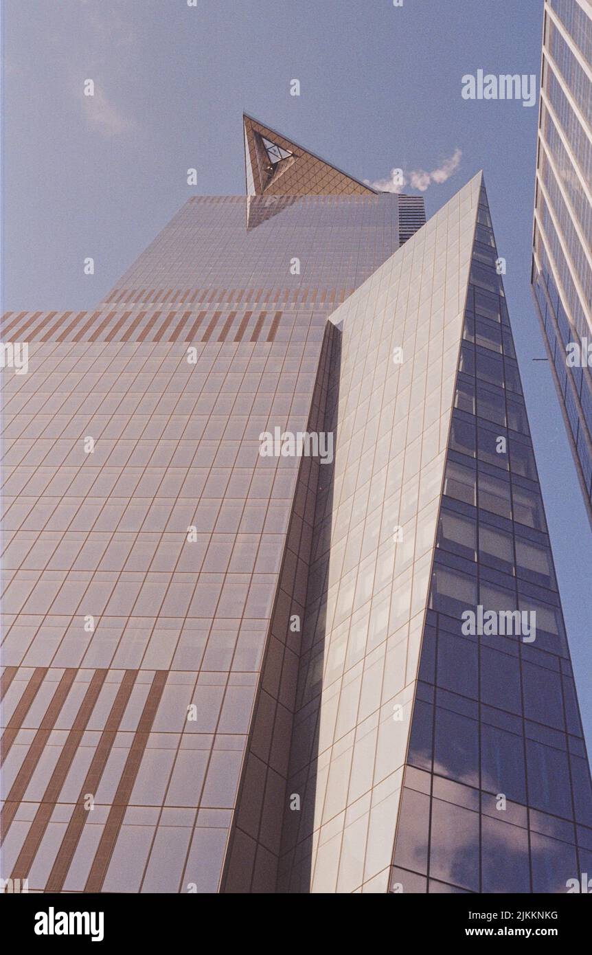A low angle shot of a modern building under a blue sky Stock Photo - Alamy