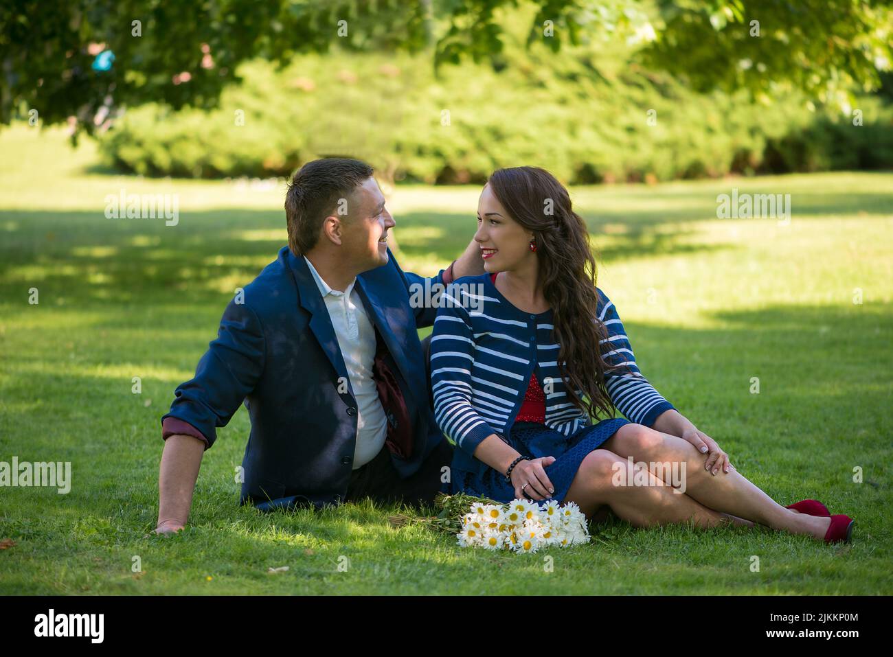 Girl sitting in a tree hi-res stock photography and images - Alamy