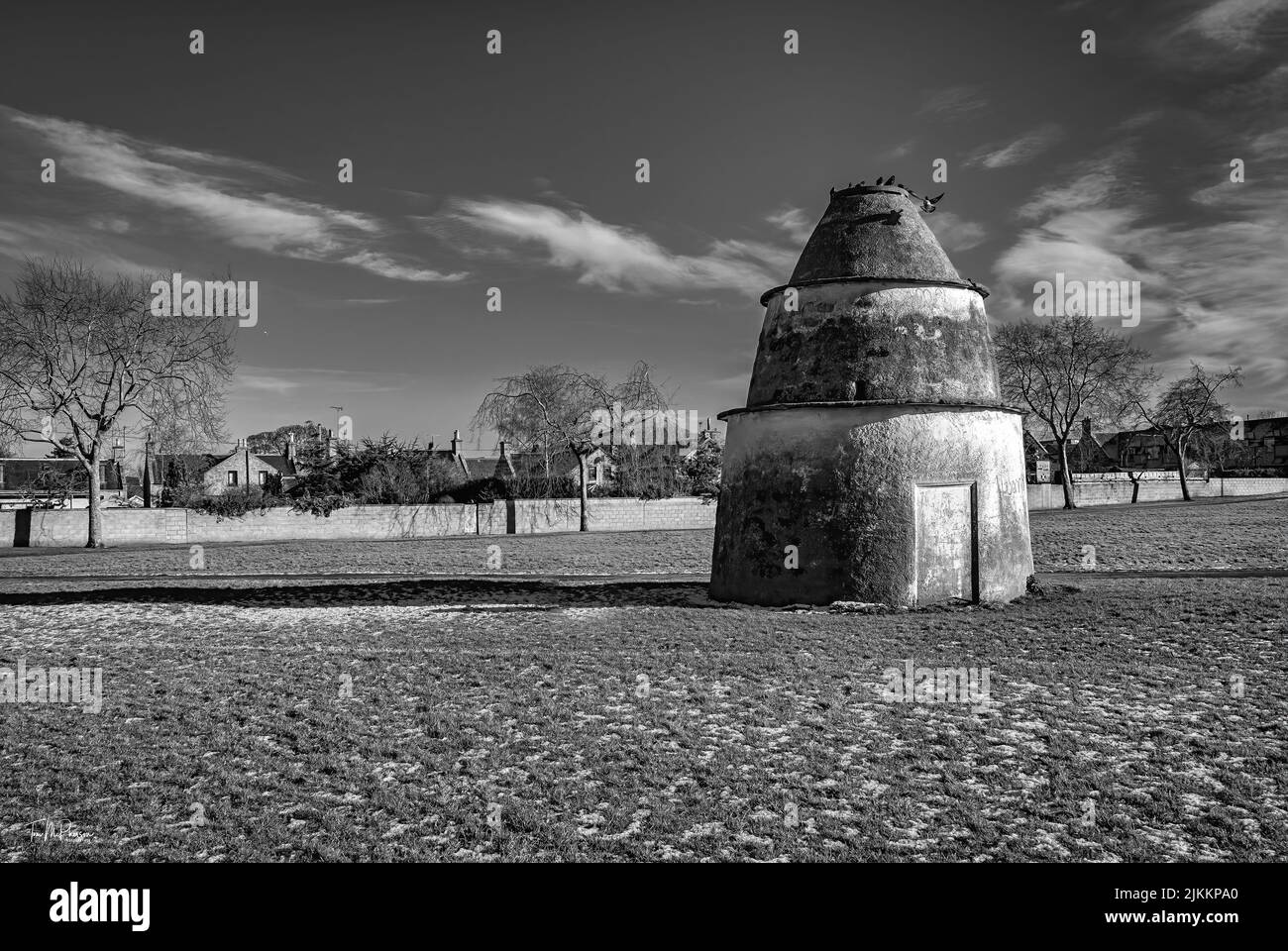 A grayscale of the 17th century dovecot with thin stone slabs Stock