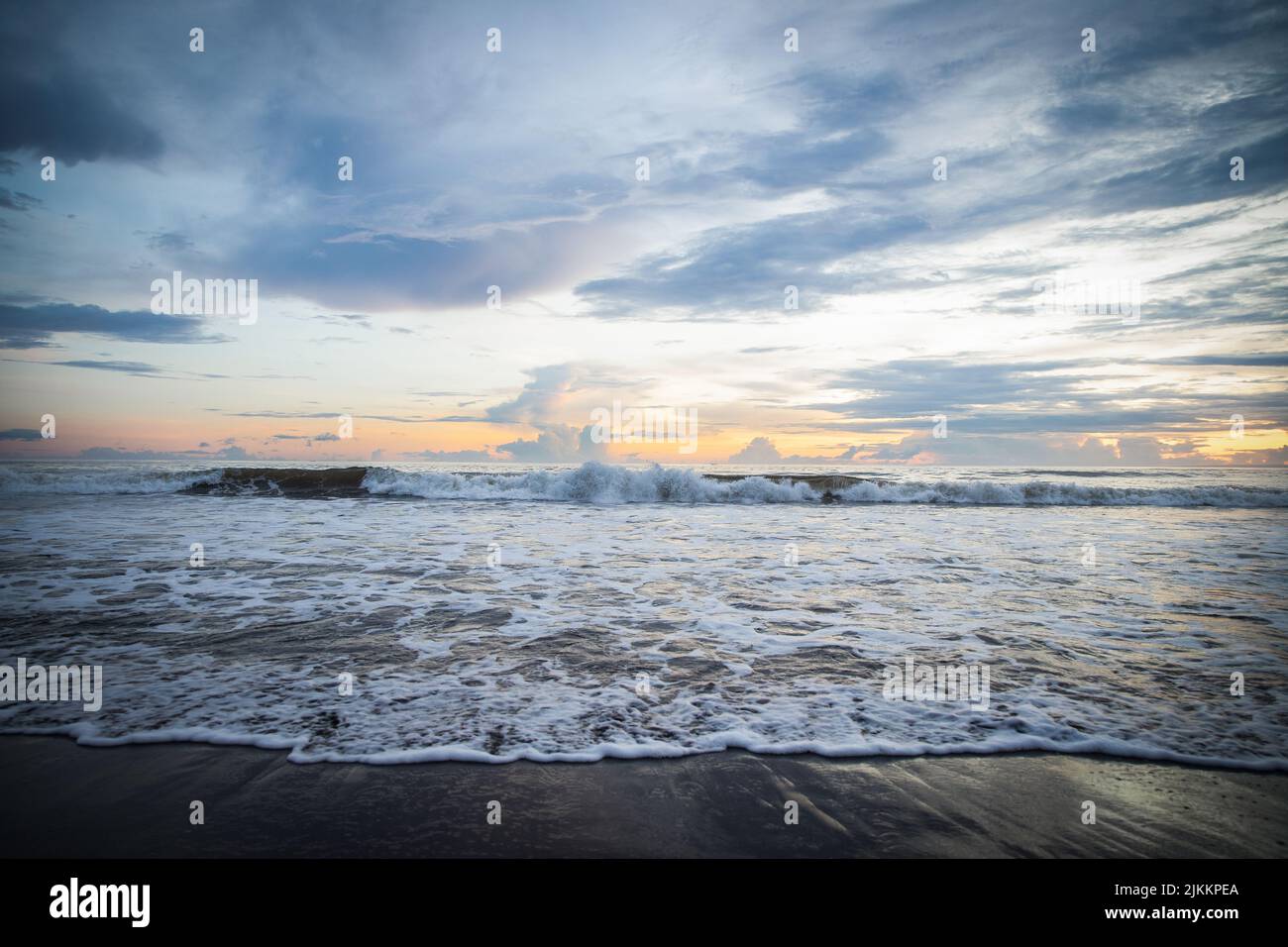 Waves splashing on beach sunny hi-res stock photography and images - Alamy