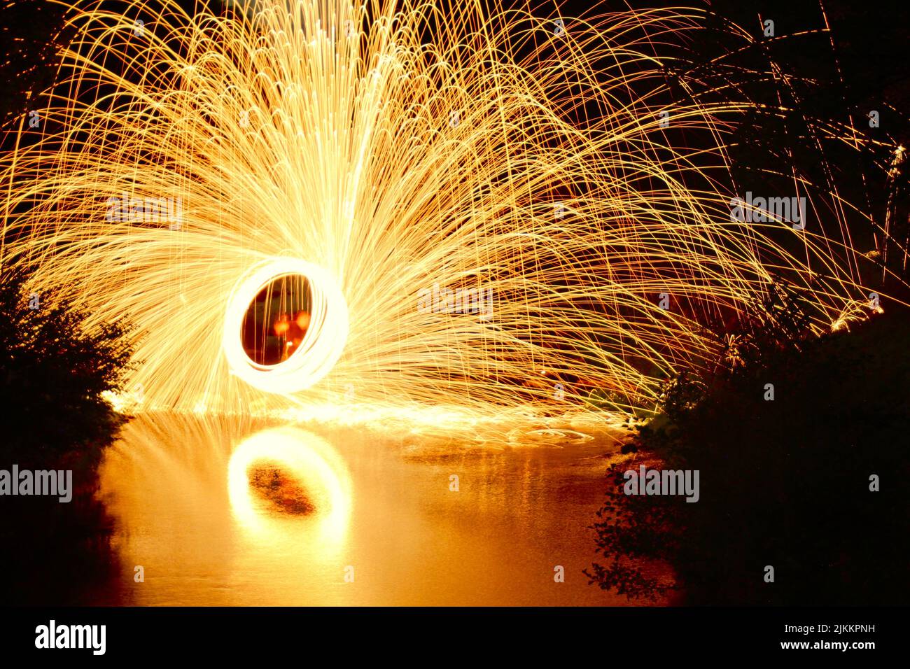 A mesmerizing view of pyrotechnic fire with the reflection on the