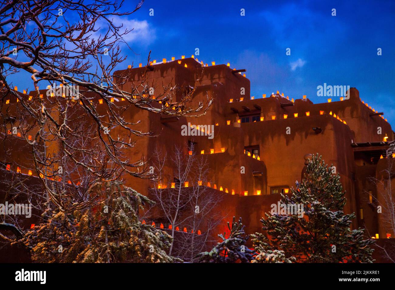 Decorative luminarias light up the roof tops and walls of the pueblo