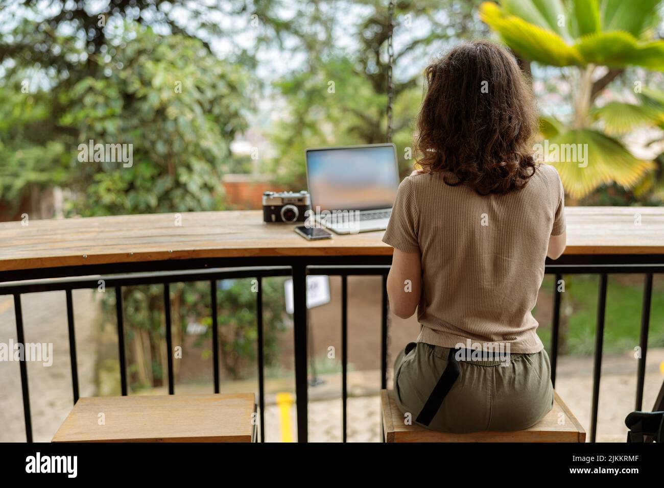 Young woman using laptop while working online Stock Photo