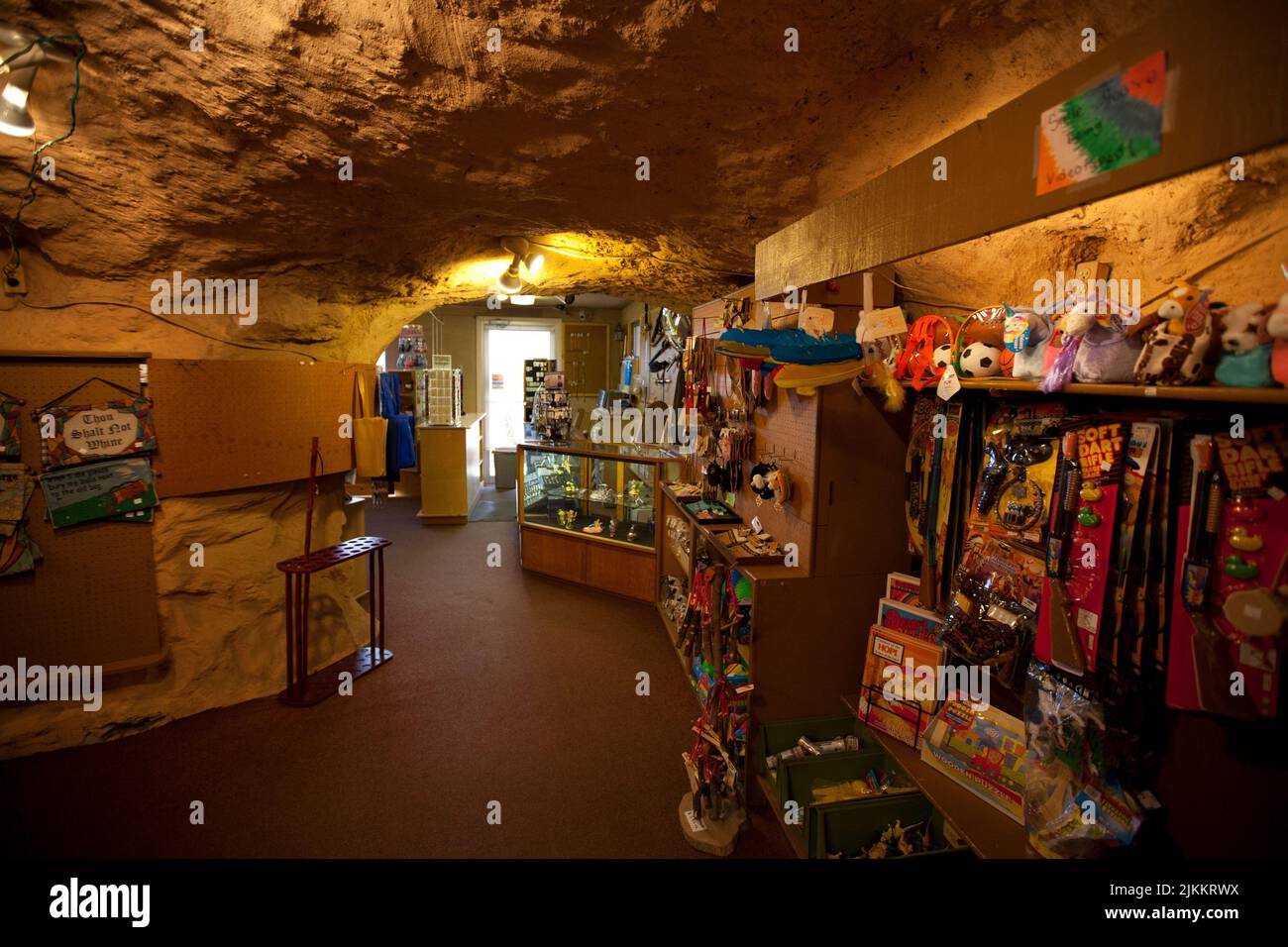 European American trading post called Hole in the Rock on traditional homelands of the Southern Ute Indians is carved inside of a large red rock cliff Stock Photo