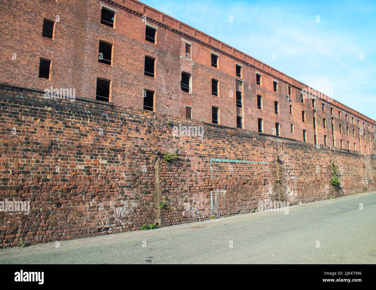A low angle side shot of a Former dockland warehouse being redeveloped, Liverpool Stock Photo