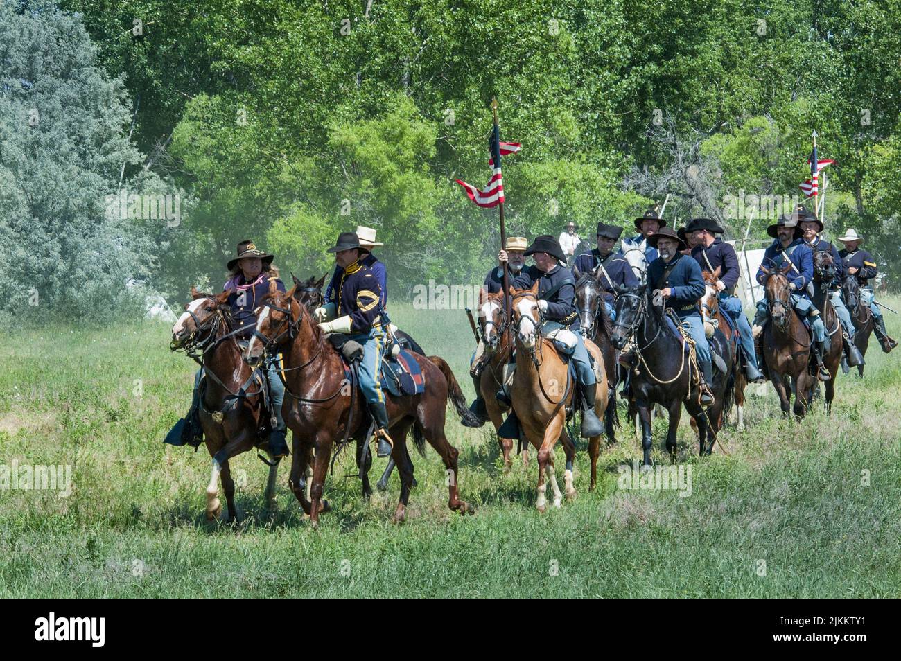 US soldiers dressed in cavalry uniforms ride on horseback during the Little Bighorn reenactment
